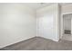 Simple bedroom with neutral carpeting and a closet, perfect for a minimalist design at 1343 W Hess Ave, Coolidge, AZ 85128
