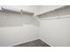 A walk-in closet offering ample storage space and featuring carpet flooring and shelving at 1343 W Hess Ave, Coolidge, AZ 85128