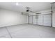 Spacious two-car garage features a clean, concrete floor and overhead door at 1343 W Hess Ave, Coolidge, AZ 85128