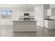 Modern kitchen featuring white cabinets, stainless steel appliances, a granite countertop, and a center island at 1343 W Hess Ave, Coolidge, AZ 85128