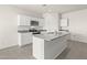 The kitchen features white cabinets, granite countertops, stainless steel appliances and a functional center island at 1343 W Hess Ave, Coolidge, AZ 85128