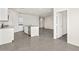 Open concept kitchen with white cabinets, an island, stainless steel appliances and a large connecting living space at 1343 W Hess Ave, Coolidge, AZ 85128