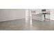 Open-concept living space with tile flooring seamlessly connecting the living area and kitchen at 1343 W Hess Ave, Coolidge, AZ 85128
