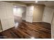 Bedroom with hardwood floors, neutral walls, and access to a closet and bathroom at 1348 E Los Arboles Dr, Tempe, AZ 85284