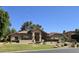 Beautiful single-story home with a well-manicured lawn and desert landscaping at 1348 E Los Arboles Dr, Tempe, AZ 85284
