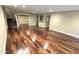 Large living area with hardwood floors and neutral paint at 1348 E Los Arboles Dr, Tempe, AZ 85284