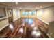 Spacious living room with large windows, recessed lighting, and hardwood floors at 1348 E Los Arboles Dr, Tempe, AZ 85284