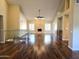Expansive living room with a stone fireplace, hardwood floors, and high ceilings at 1348 E Los Arboles Dr, Tempe, AZ 85284