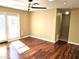 Bright living room with hardwood floors, leading to a glass door at 1348 E Los Arboles Dr, Tempe, AZ 85284