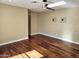Cozy living room with stylish ceiling fan and hardwood floors at 1348 E Los Arboles Dr, Tempe, AZ 85284