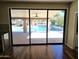Patio sliding glass doors overlooking the pool and outdoor living space at 1348 E Los Arboles Dr, Tempe, AZ 85284