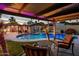 Outdoor living with a covered patio seating area and a sparkling backyard pool at 13631 N Canterbury Dr, Phoenix, AZ 85023