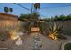 Relaxing backyard retreat with swing, desert plants, and serene ambience at 13631 N Canterbury Dr, Phoenix, AZ 85023