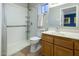Bathroom featuring a walk-in shower, single sink vanity, and tiled flooring at 13631 N Canterbury Dr, Phoenix, AZ 85023