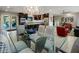 Bright dining area showcasing modern lighting fixtures and stylish chairs connecting to an open concept kitchen and living room at 13631 N Canterbury Dr, Phoenix, AZ 85023