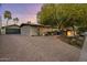 Well-maintained home featuring a brick driveway and an appealing desert landscape at 13631 N Canterbury Dr, Phoenix, AZ 85023