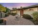 Beautifully landscaped front yard with a quaint table set, showcasing the home's curb appeal at 13631 N Canterbury Dr, Phoenix, AZ 85023