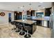 Open kitchen layout with a large island and bar seating, ideal for socializing and dining at 13631 N Canterbury Dr, Phoenix, AZ 85023