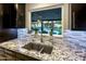A view of the kitchen sink with a nice view of the backyard swimming pool at 13631 N Canterbury Dr, Phoenix, AZ 85023