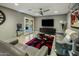 Cozy living room features a modern ceiling fan, sleek furniture, and sliding glass doors leading to an outdoor patio at 13631 N Canterbury Dr, Phoenix, AZ 85023