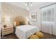 Charming bedroom with patterned accent wall, stylish furnishings, and cozy decor at 1366 W Hess Ave, Coolidge, AZ 85128
