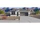 Charming single-story home showcasing desert landscaping and a two-car garage at 1366 W Hess Ave, Coolidge, AZ 85128