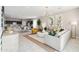 Open-concept living room with modern decor, neutral colors, and seamless access to kitchen at 1366 W Hess Ave, Coolidge, AZ 85128