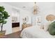 Serene bedroom with neutral tones, stylish lighting, and an ensuite bathroom in view at 1366 W Hess Ave, Coolidge, AZ 85128