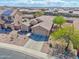 Aerial view of a well-kept property with a tile roof and desert landscaping at 1385 E Martha Dr, Casa Grande, AZ 85122