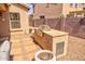 Backyard featuring a built-in grill and low maintenance desert landscaping at 1385 E Martha Dr, Casa Grande, AZ 85122