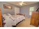 Comfortable bedroom featuring a bed with ceiling fan, and dresser at 1385 E Martha Dr, Casa Grande, AZ 85122