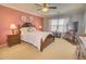 Inviting main bedroom featuring a decorative bed frame, bedside tables and lamps at 1385 E Martha Dr, Casa Grande, AZ 85122