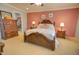 Inviting main bedroom featuring a decorative bed frame, bedside tables, and a walk-in closet at 1385 E Martha Dr, Casa Grande, AZ 85122