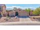Attractive single-Gathering home with well-kept desert landscaping and a two-car garage at 1385 E Martha Dr, Casa Grande, AZ 85122