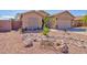 Charming single-Gathering home with a well-maintained desert-landscaped front yard at 1385 E Martha Dr, Casa Grande, AZ 85122
