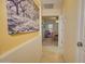 Hallway showcasing an art piece on the wall, leading to an office and other rooms at 1385 E Martha Dr, Casa Grande, AZ 85122