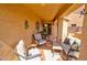 Inviting covered patio with comfortable seating, providing a relaxing outdoor living space at 1385 E Martha Dr, Casa Grande, AZ 85122