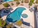 An aerial view showcasing the pool, spa, lounge area, and dining area in the backyard at 14241 N 56Th Pl, Scottsdale, AZ 85254