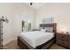 Charming bedroom features wood floors, lovely window, and nautical décor, creating a serene space at 14241 N 56Th Pl, Scottsdale, AZ 85254