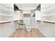 Spacious walk-in closet with ample shelving and a convenient layout, perfect for organizing wardrobes at 14241 N 56Th Pl, Scottsdale, AZ 85254