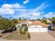 Charming single-story home with a well-manicured lawn and a two car garage in a sunny neighborhood at 14241 N 56Th Pl, Scottsdale, AZ 85254
