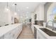 Bright kitchen with stainless steel appliances, gray backsplash, and a view into the dining room at 14241 N 56Th Pl, Scottsdale, AZ 85254