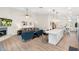 Open-concept living room, kitchen, and dining area with ample seating and modern amenities at 14241 N 56Th Pl, Scottsdale, AZ 85254