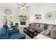Comfortable living room with a fireplace and a large sectional sofa at 14241 N 56Th Pl, Scottsdale, AZ 85254