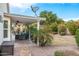 Covered patio with outdoor dining, seating, and a ceiling fan for comfortable gatherings at 14241 N 56Th Pl, Scottsdale, AZ 85254