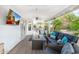 Inviting covered patio with comfortable seating and outdoor TV, perfect for entertaining and relaxation at 14241 N 56Th Pl, Scottsdale, AZ 85254