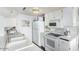 Charming galley kitchen featuring white appliances and countertops at 14261 N Oakwood Ln, Fountain Hills, AZ 85268