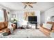 Inviting living room with hardwood floors, a ceiling fan, and neutral paint that adds a modern feel at 14261 N Oakwood Ln, Fountain Hills, AZ 85268