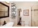 Bathroom with updated hardware and unique towel storage at 15061 W Pinchot Ave, Goodyear, AZ 85395