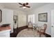 Spare bedroom featuring a murphy bed, a sitting area, and views to the outside at 15061 W Pinchot Ave, Goodyear, AZ 85395